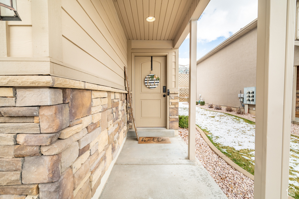 Property entrance with stone siding