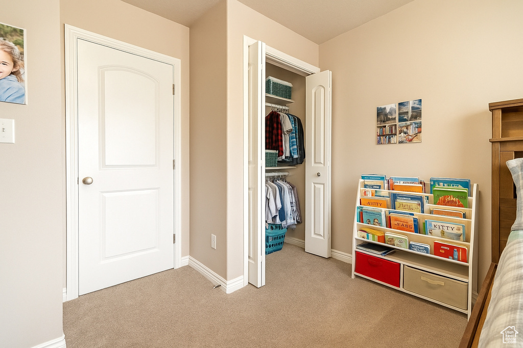 Carpeted bedroom with baseboards