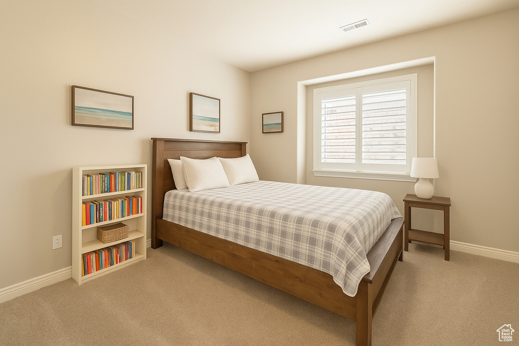 Carpeted bedroom featuring baseboards