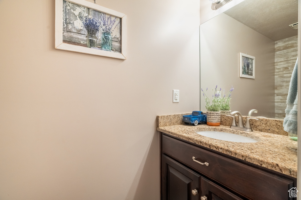 Bathroom with visible vents and vanity