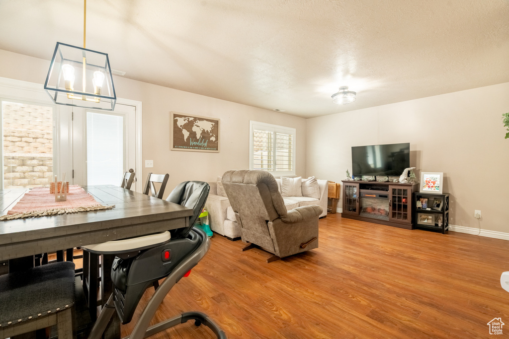 Dining area featuring light wood-style floors and baseboards
