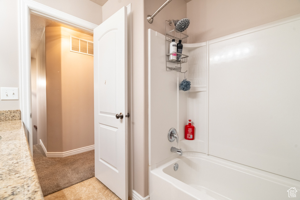 Full bath with visible vents and washtub / shower combination