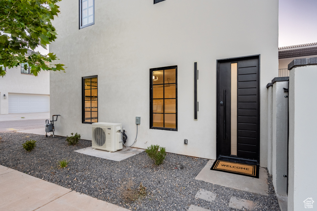 Doorway to property with ac unit