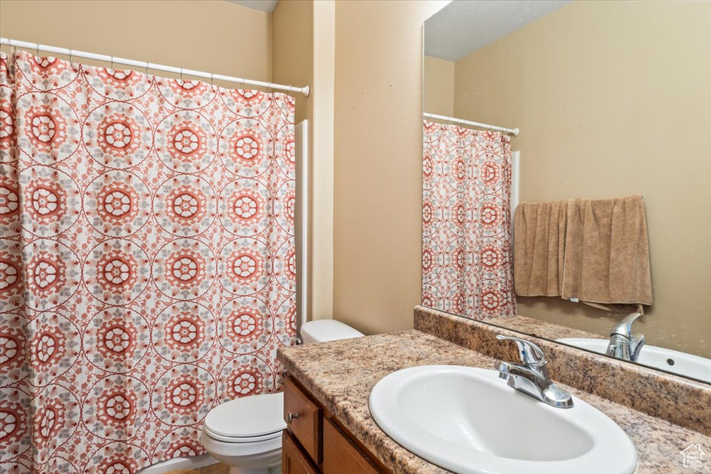 Bathroom with toilet and vanity