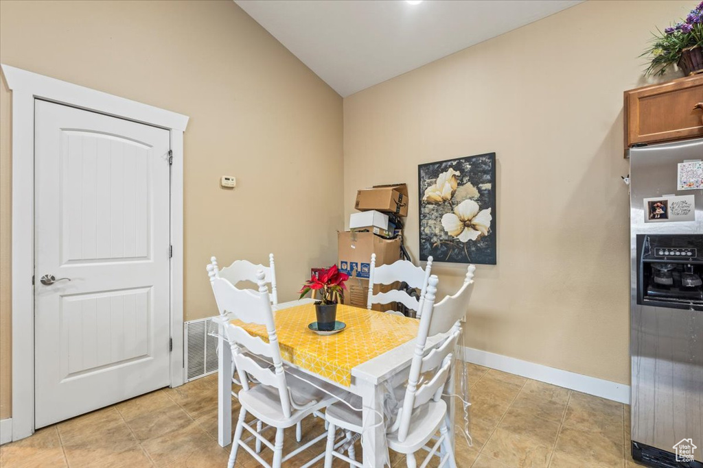 Dining space with vaulted ceiling