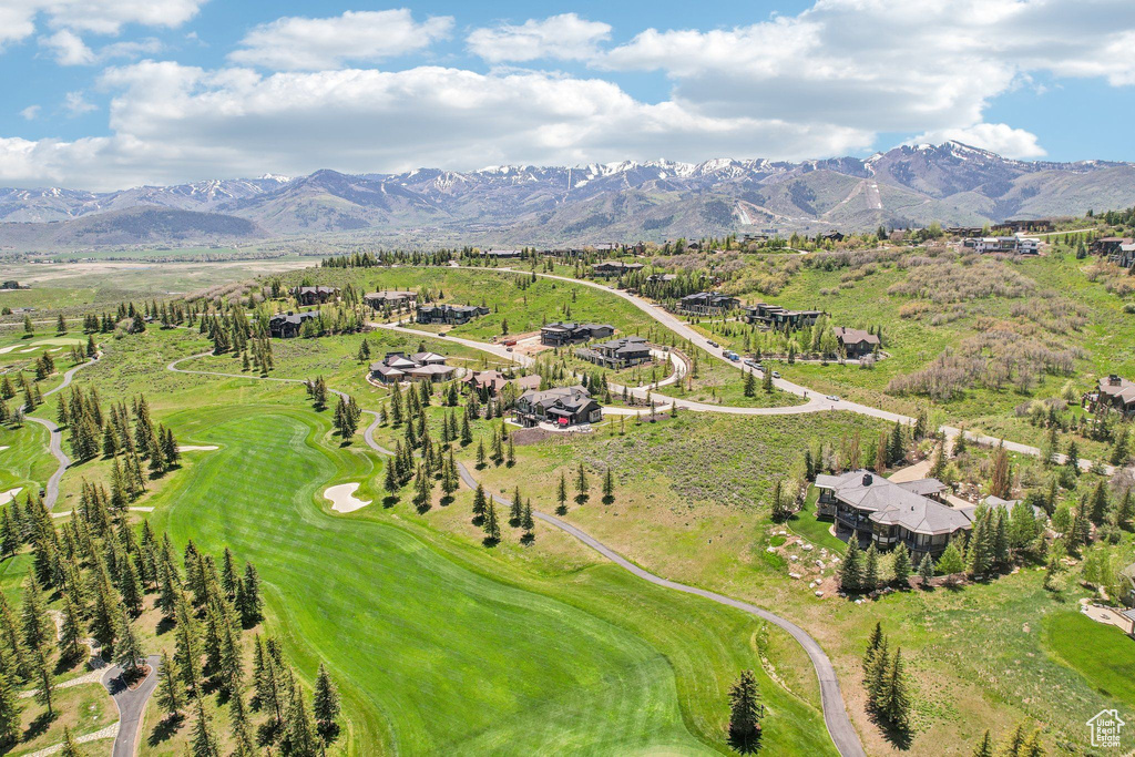 Drone / aerial view of mountains and a local golf course