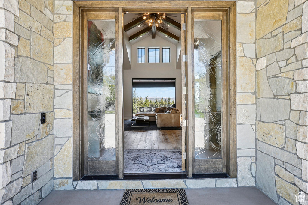 View of exterior entry featuring stone siding