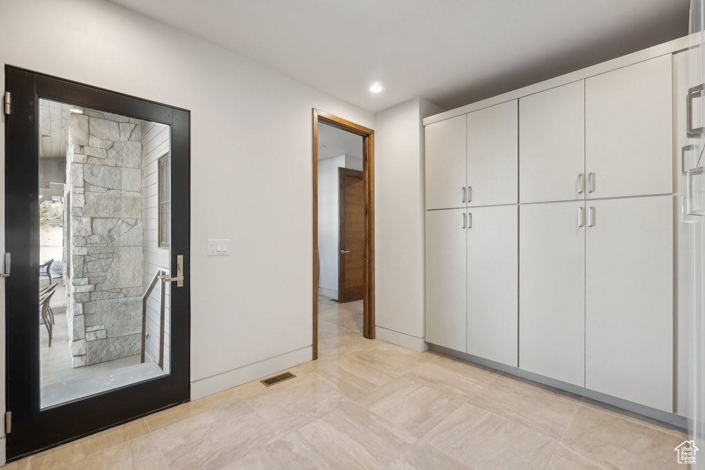 Unfurnished bedroom with recessed lighting and baseboards