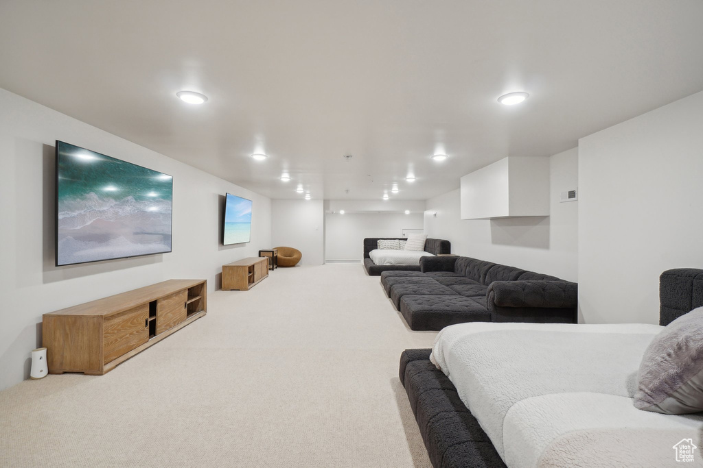 Living area featuring carpet floors and recessed lighting