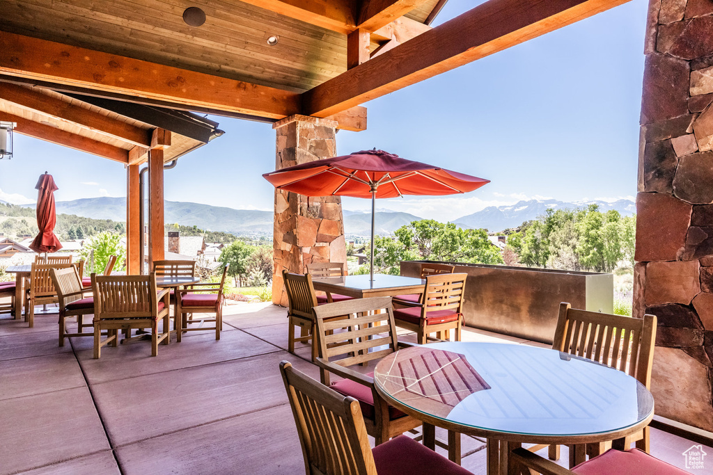 View of patio / terrace with outdoor dining area and a mountain view