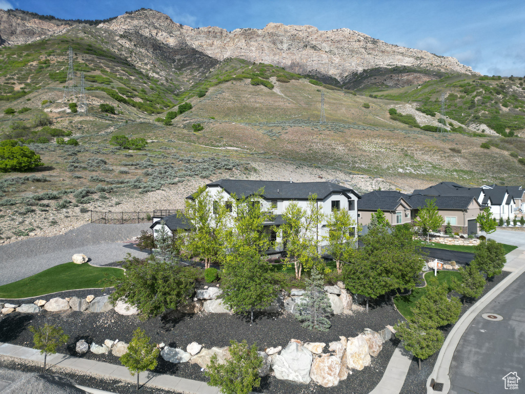 Property view of mountains with a residential view
