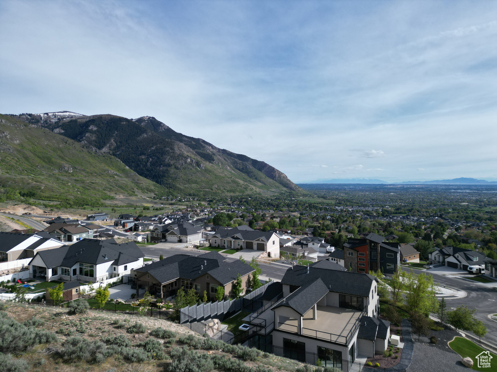 Property view of mountains with a residential view