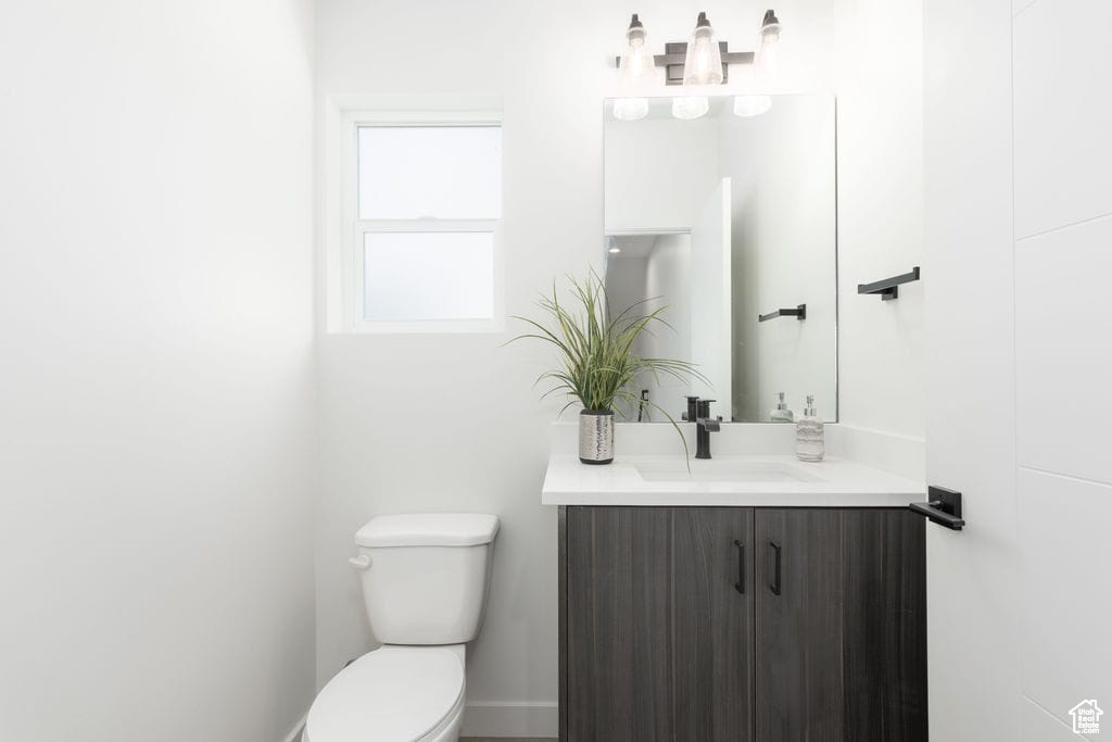 Bathroom featuring toilet and vanity