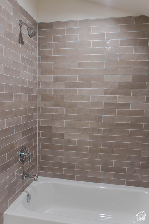 Bathroom featuring tiled shower / bath