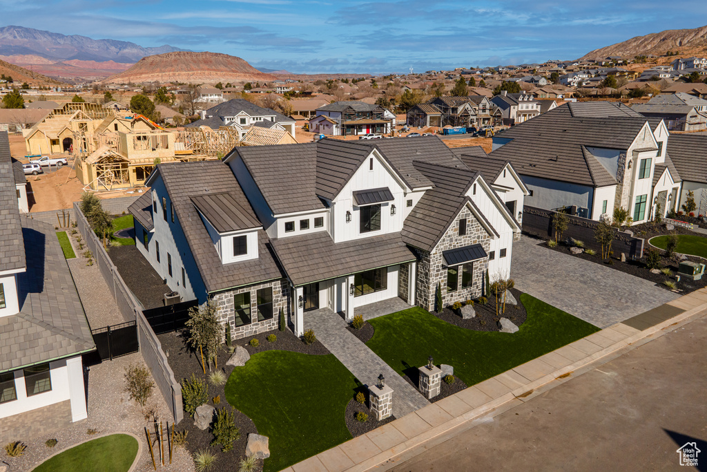 Birds eye view of property featuring a mountain view