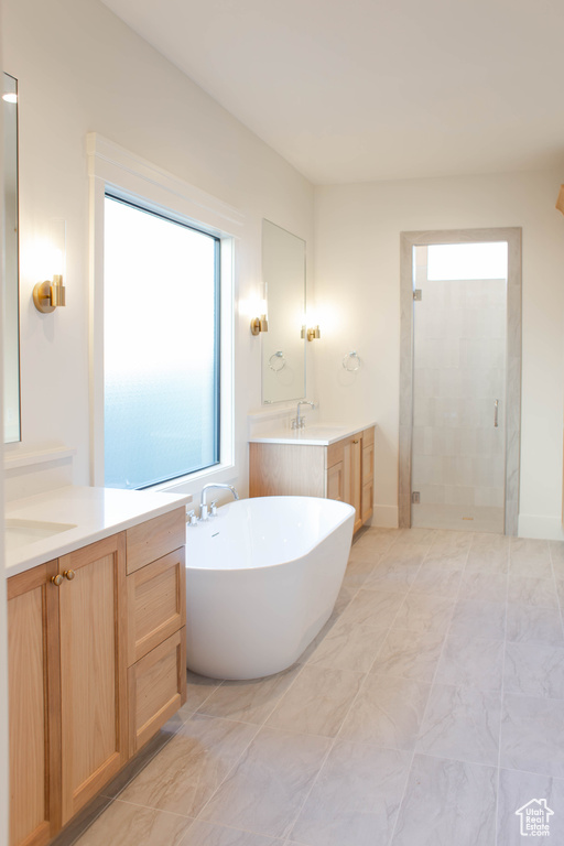 Bathroom with independent shower and bath and vanity