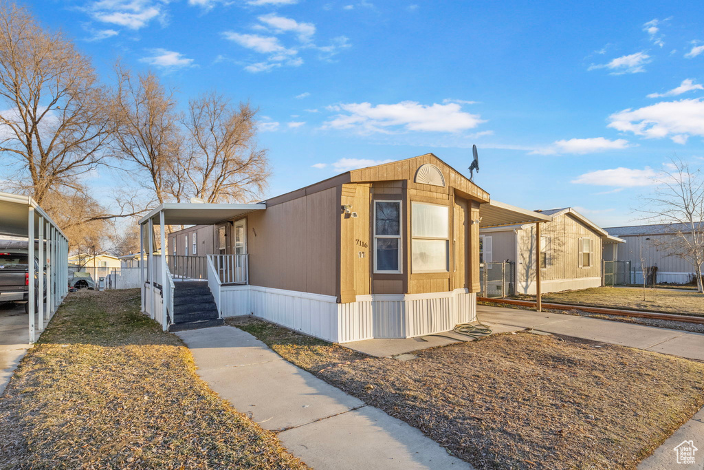 View of front of home featuring a carport