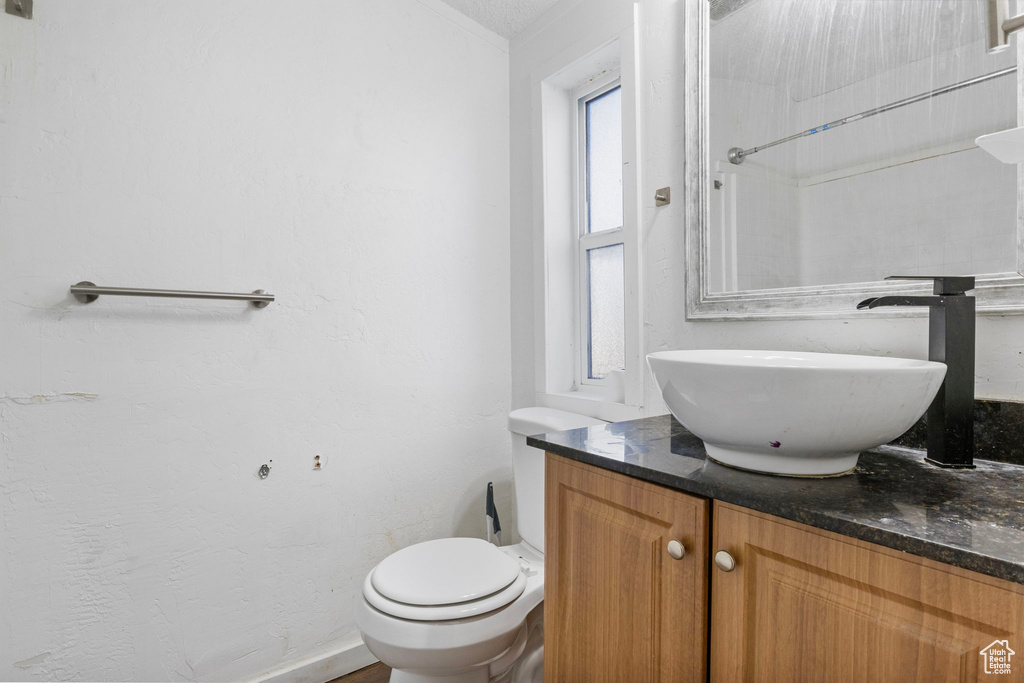 Bathroom featuring toilet and vanity