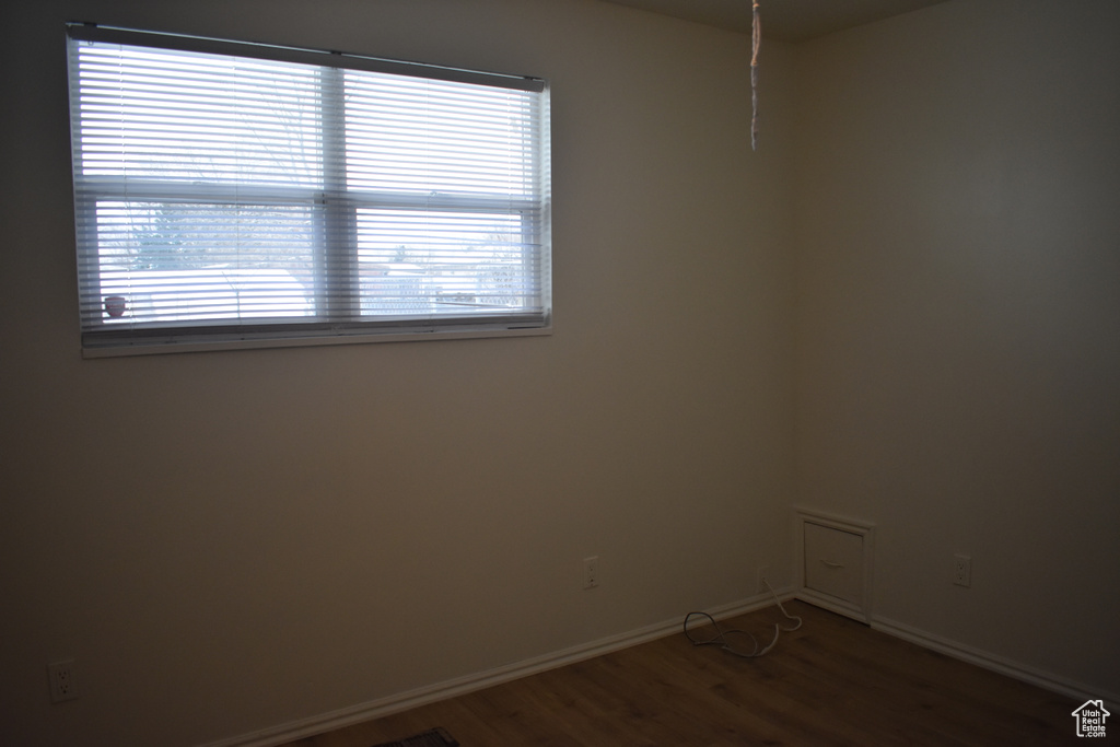 Spare room with hardwood / wood-style flooring