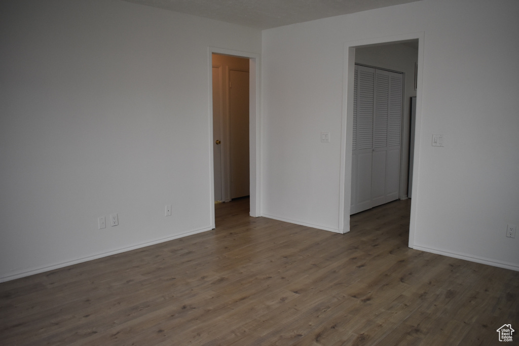 Spare room featuring dark hardwood / wood-style flooring