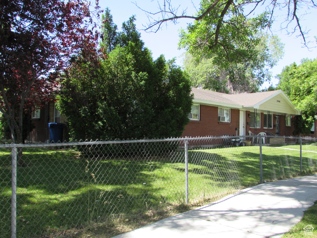 View of front of property with a front lawn