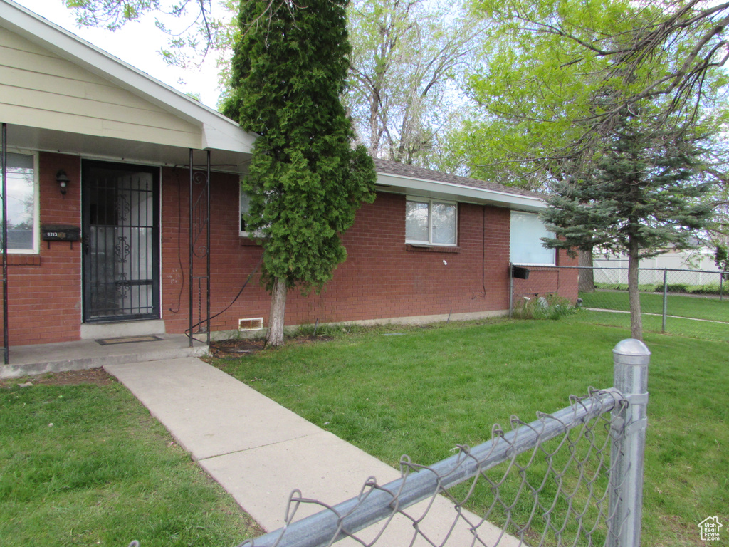 Exterior space with a yard