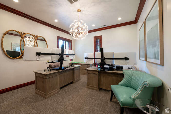 Home office featuring crown molding and a chandelier