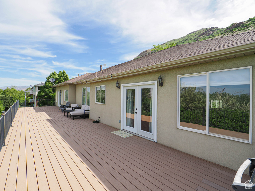 Wooden deck featuring french doors