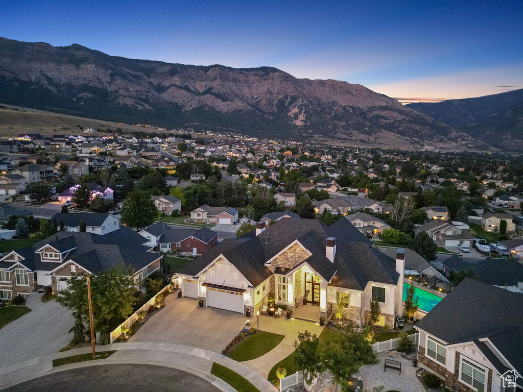 Aerial view at dusk featuring a mountain view