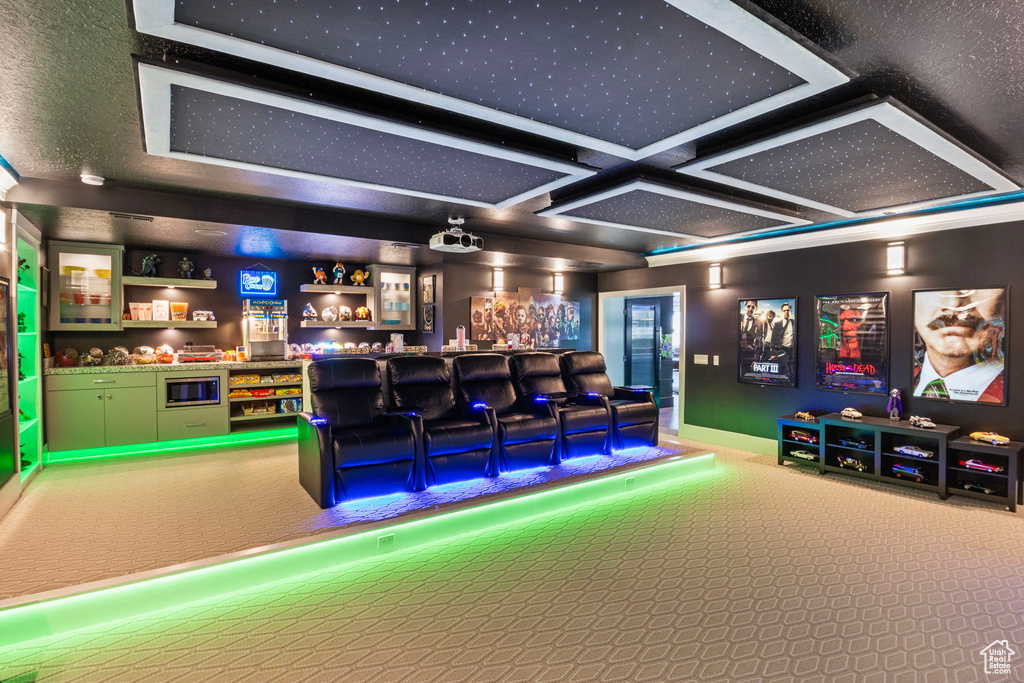 Carpeted cinema with indoor bar and coffered ceiling