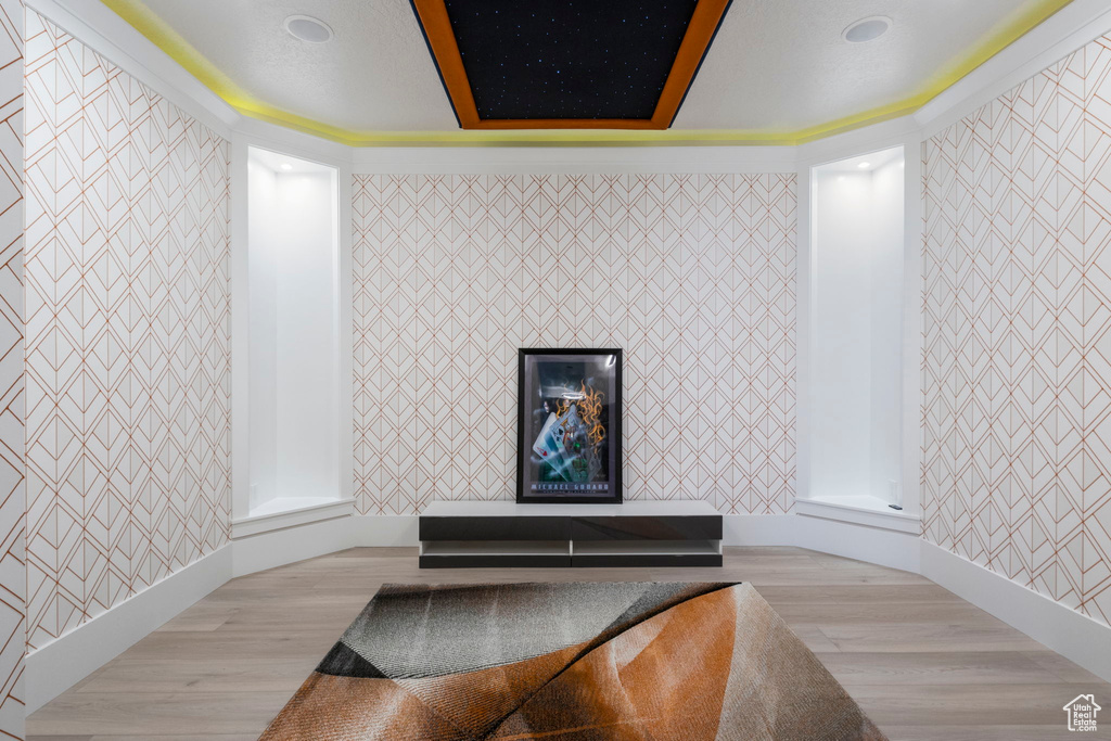 Room details featuring wood-type flooring and crown molding