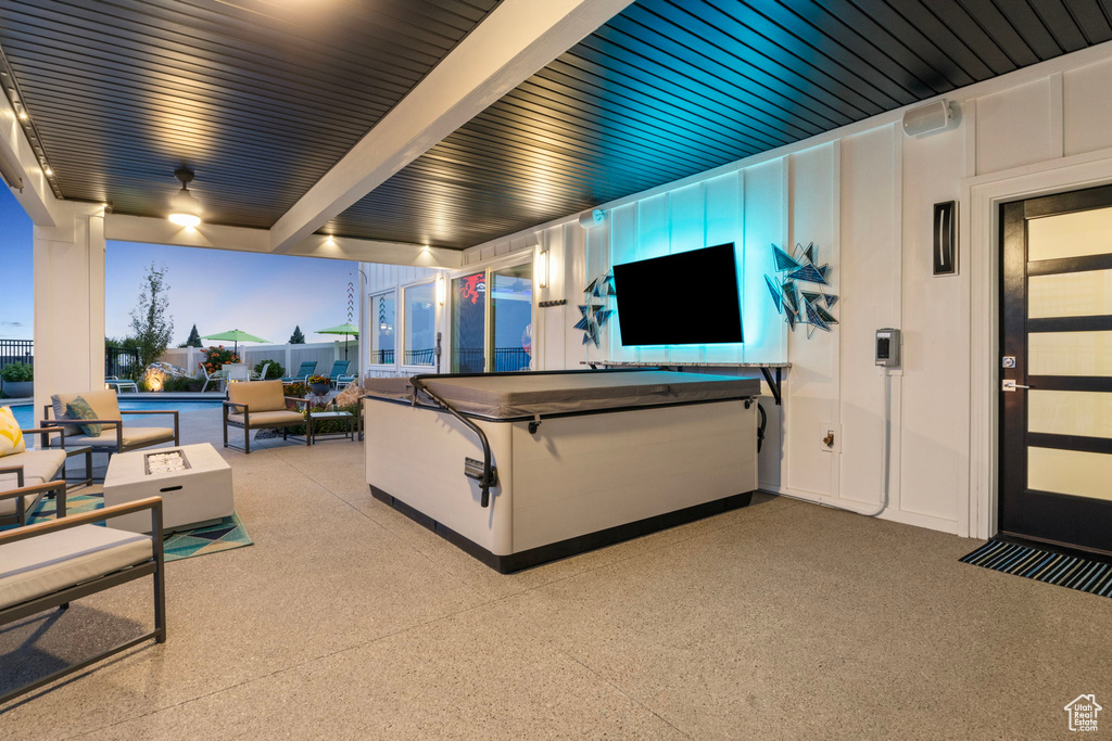 View of patio / terrace featuring a pool with hot tub and an outdoor living space