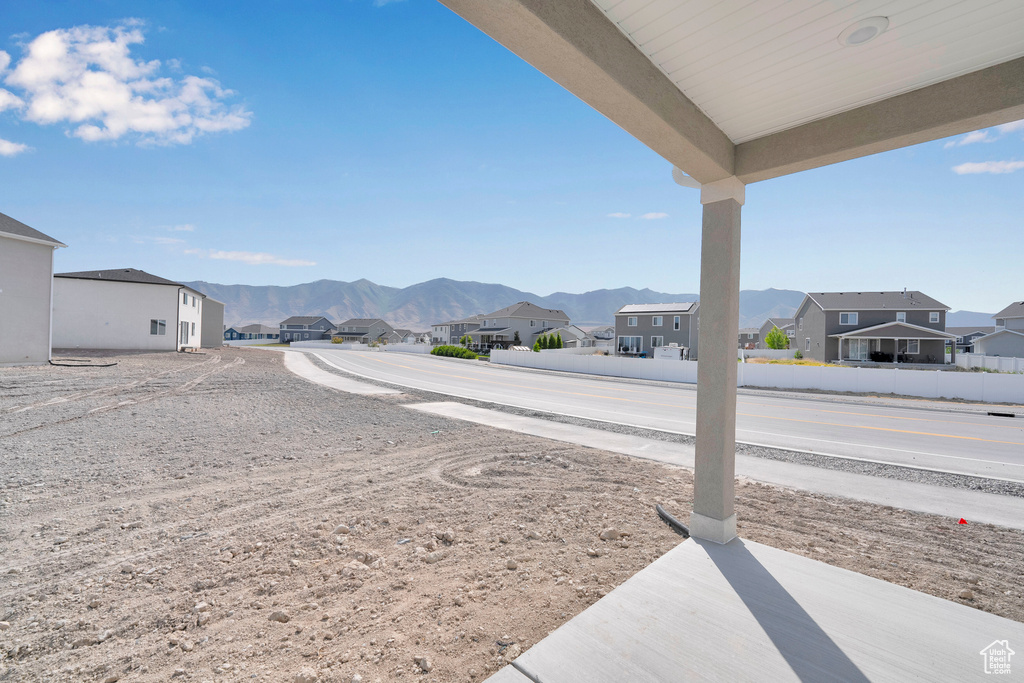 View of yard featuring a residential view and a mountain view