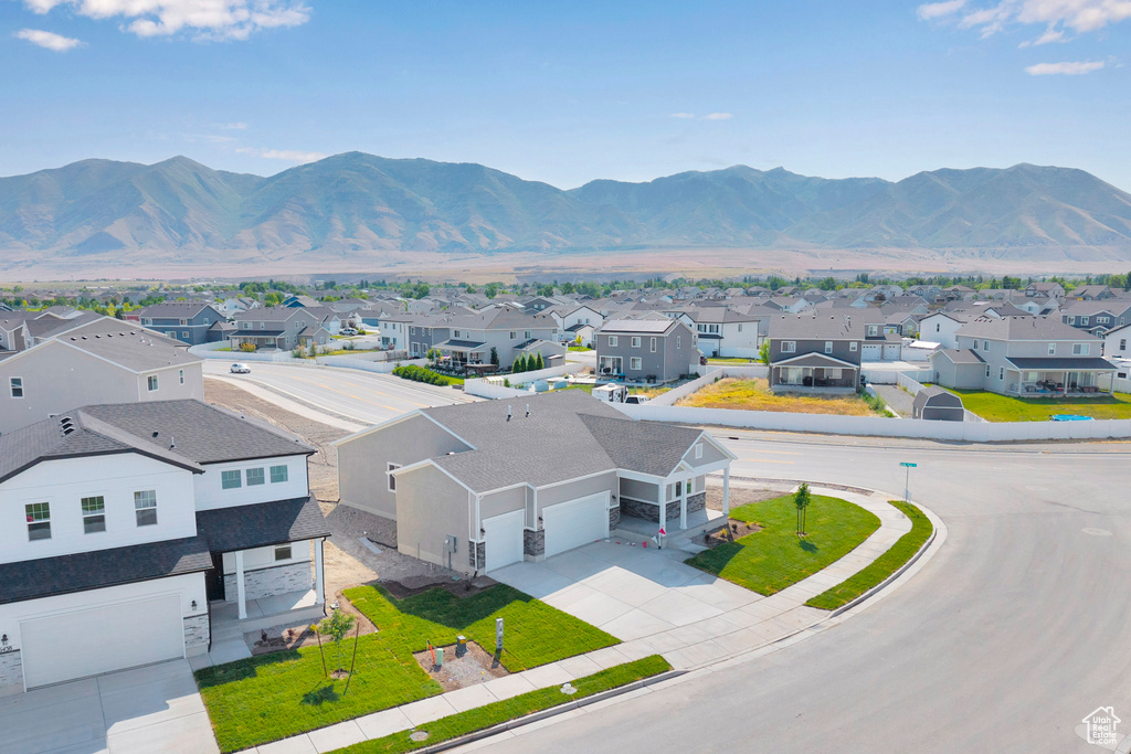 View of mountain backdrop featuring nearby suburban area