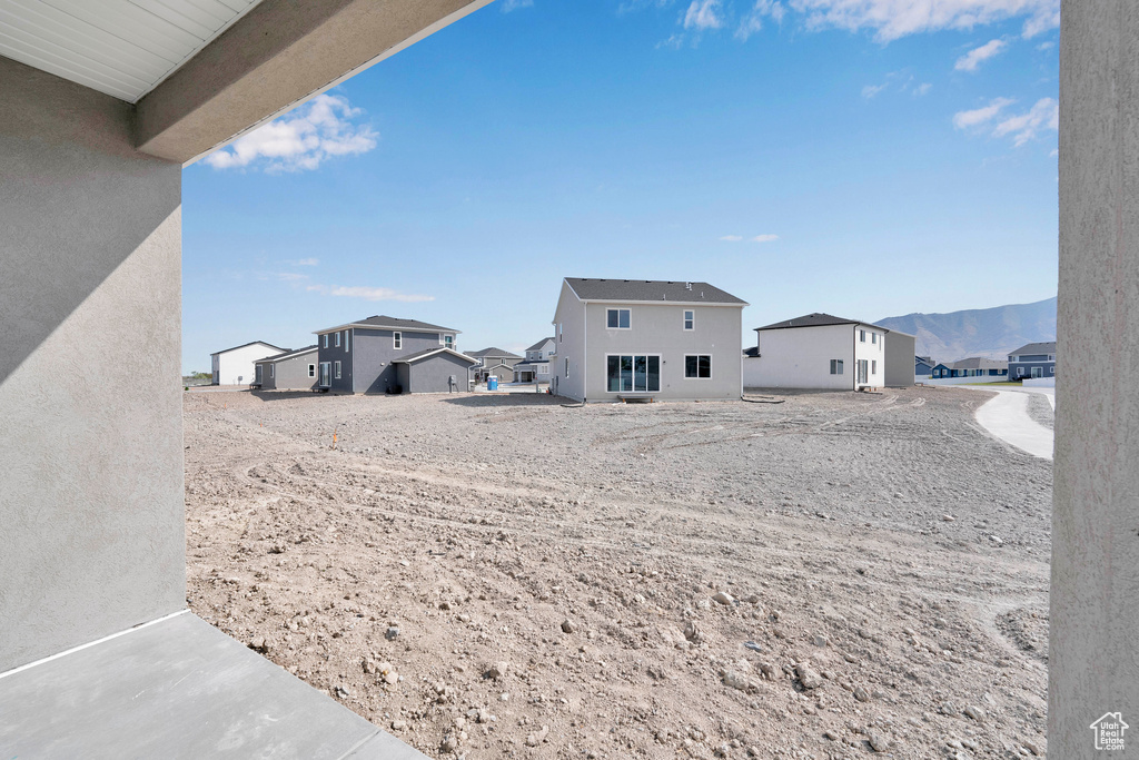 View of yard featuring a residential view and a mountain view