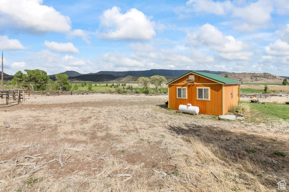 View of yard with a mountain view and a rural view