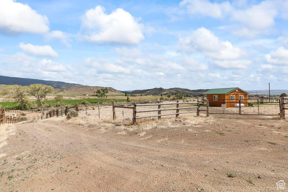 View of yard featuring a view of rural / pastoral area and a mountain view