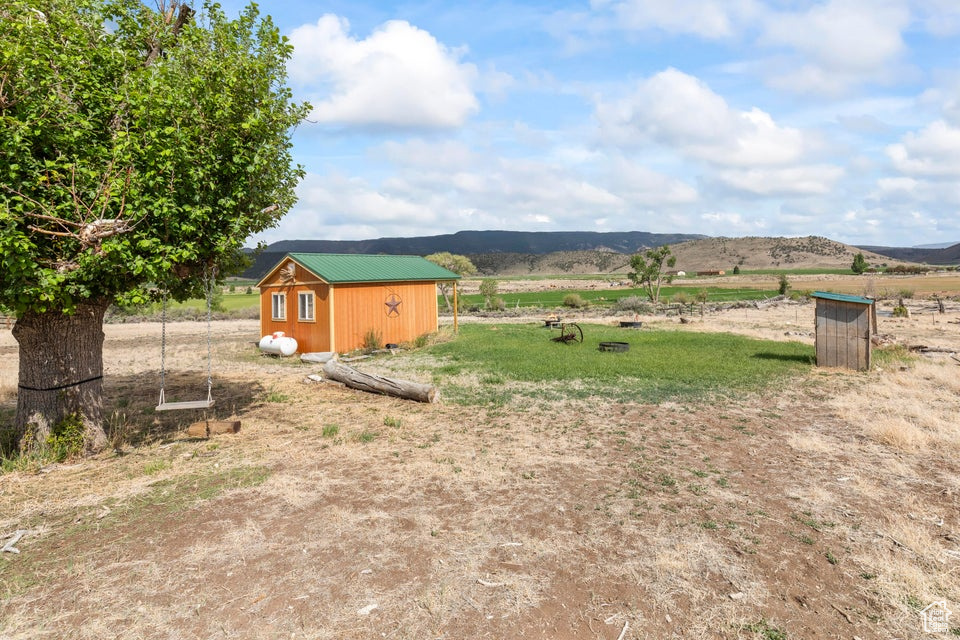 View of yard with a view of rural / pastoral area