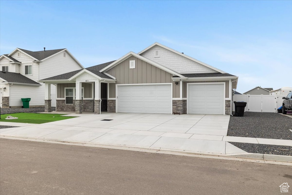 Craftsman inspired home featuring a garage