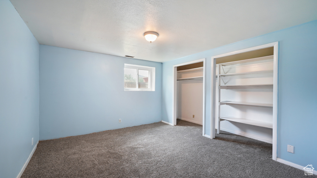 Unfurnished bedroom with carpet floors and a closet