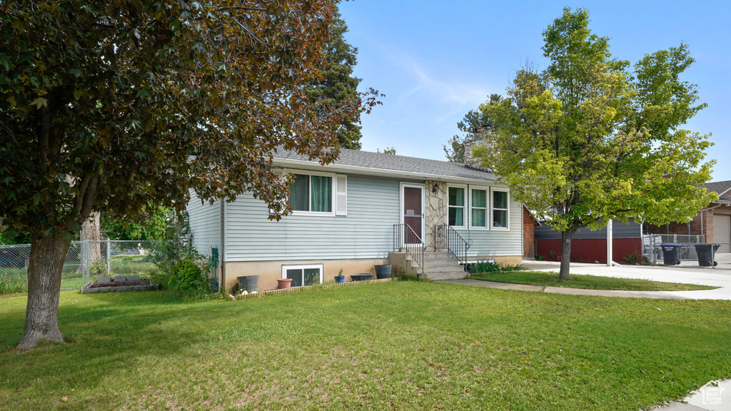 View of front of house with entry steps, a garage, and concrete driveway
