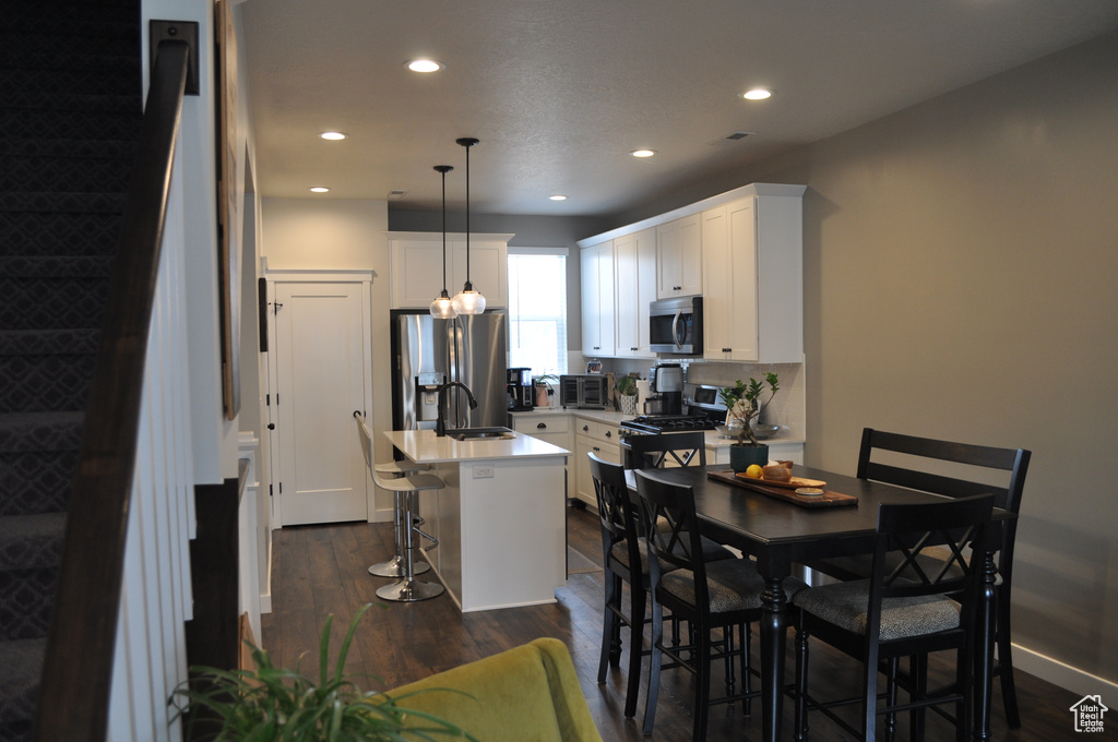 Dining area featuring dark hardwood / wood-style flooring