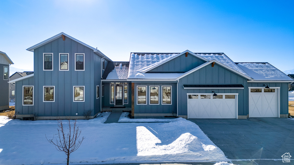 View of front of property featuring a garage