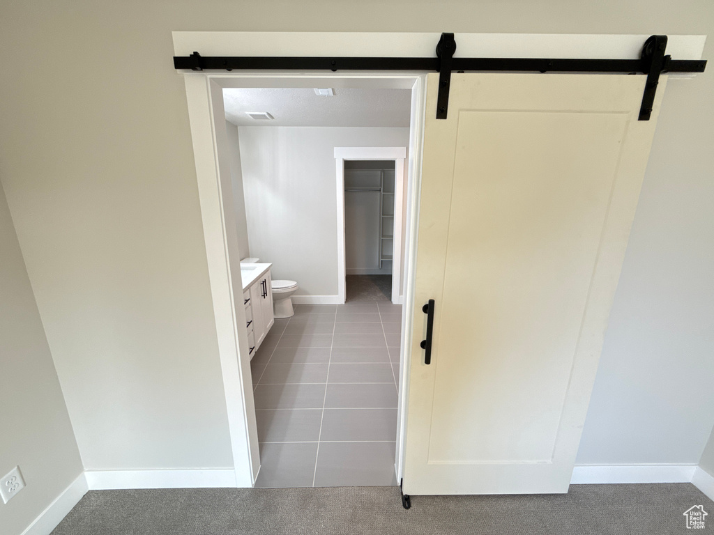 Bathroom featuring tile patterned flooring and vanity