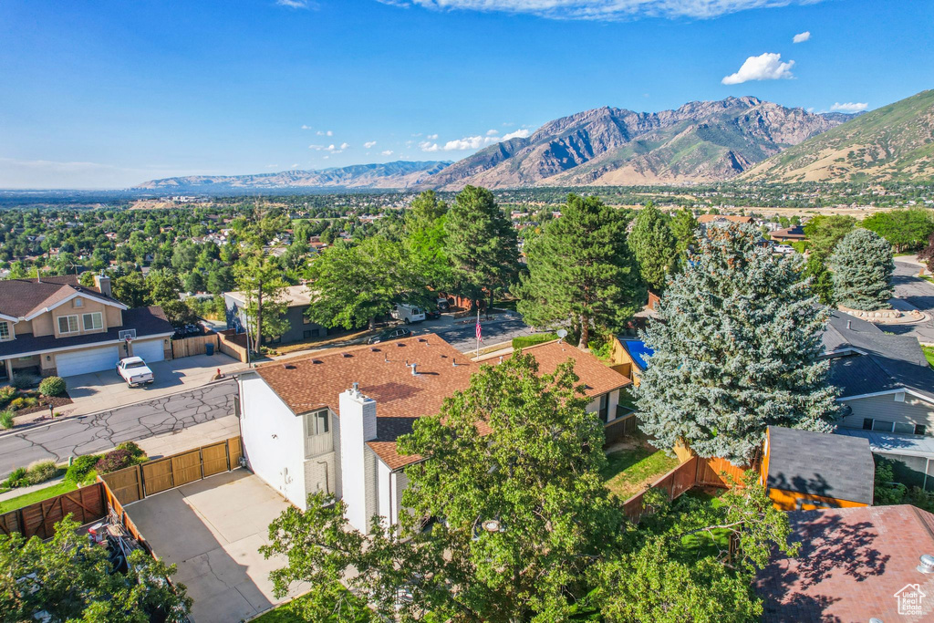 Birds eye view of property with a mountain view and a residential view