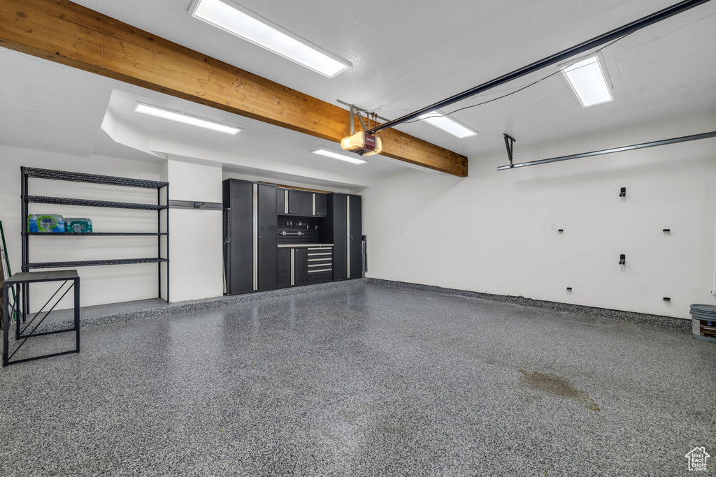 Garage featuring a garage door opener