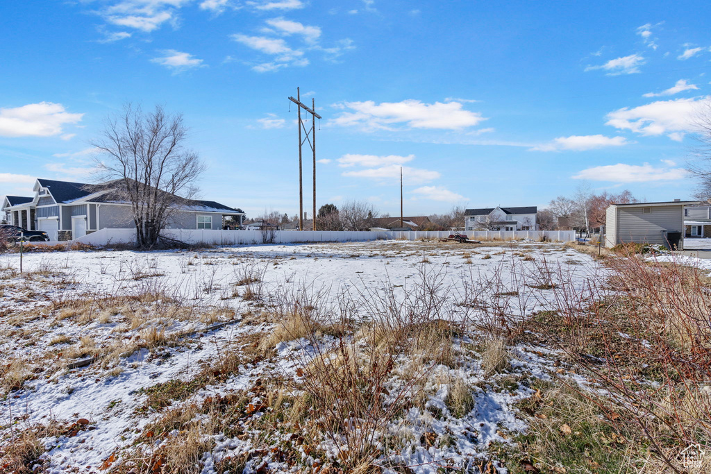 View of yard covered in snow