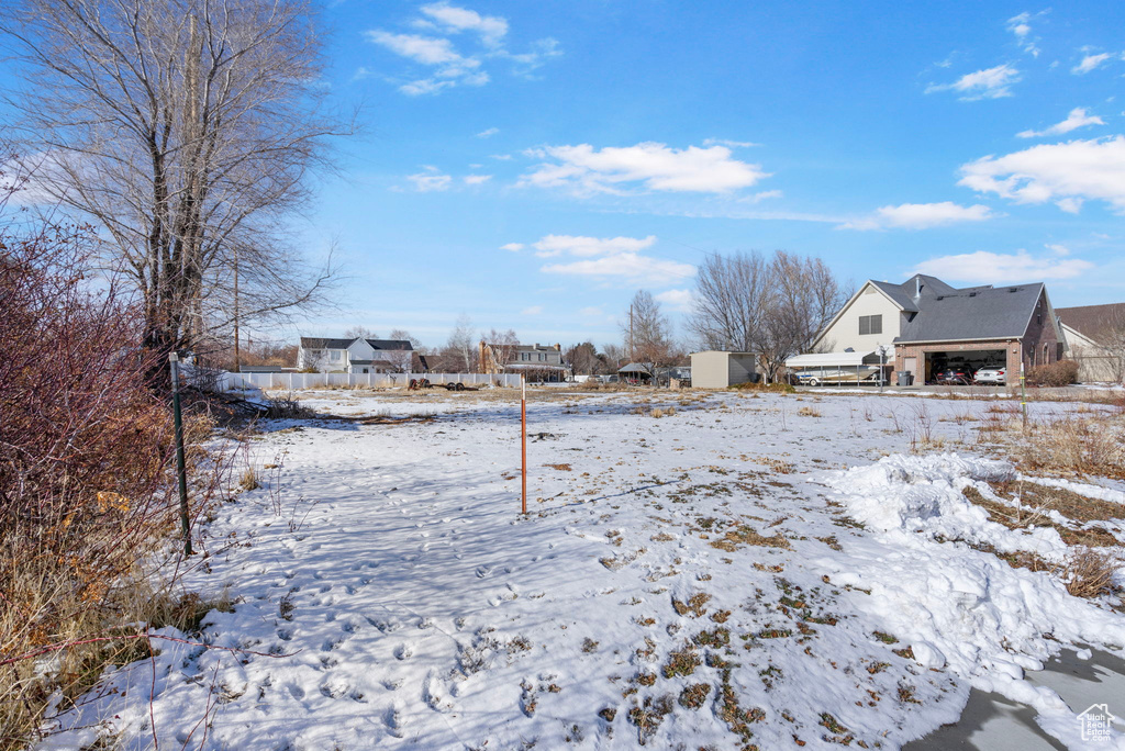 View of yard covered in snow