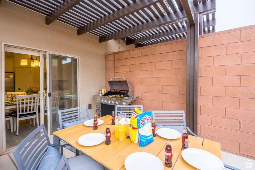 View of patio with a pergola
