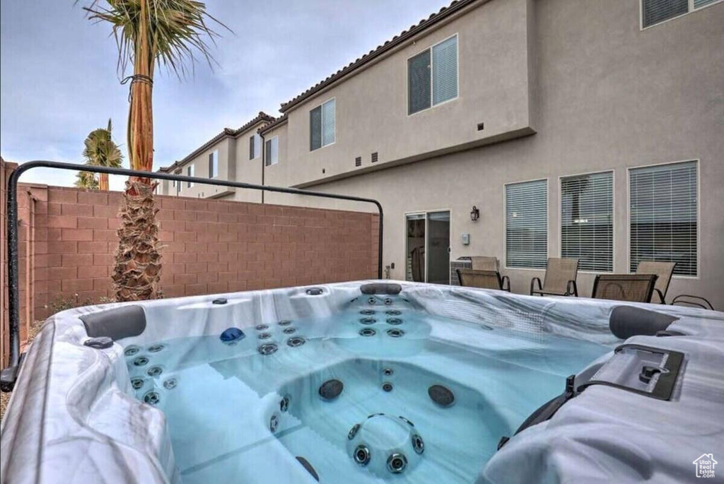Exterior space with a hot tub